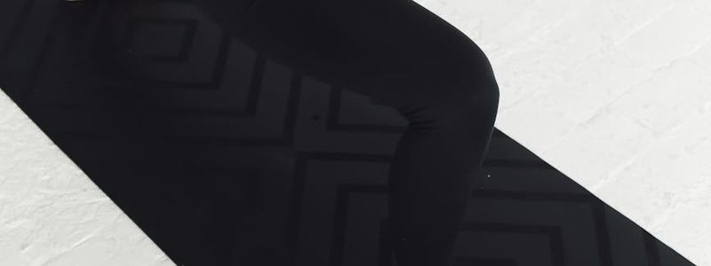 Soft focus of someone practicing fluid movements on mat